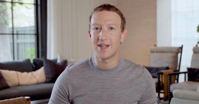 Mark Zuckerberg in a gray shirt speaking in a living room, the man that changed Facebook's  name to ...
