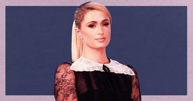 Paris Hilton wearing a black dress with a white lace collar