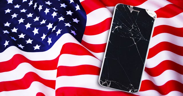 Broken smartphone in front of the USA flag