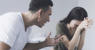 Woman crying while her husband yells at her as one of the eight signs being in an emotionally abusiv...