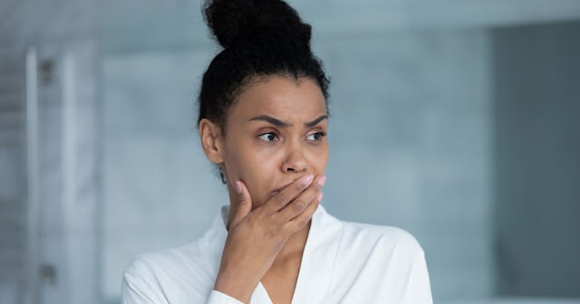 A close-up of a woman is worried about getting pregnant after a miscarriage.