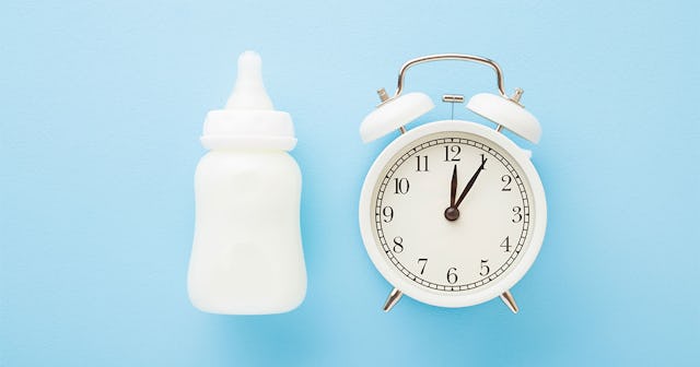A baby bottle and a clock