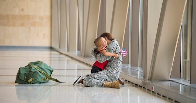 Female veteran hugging her son in airport — Veterans Day quotes.