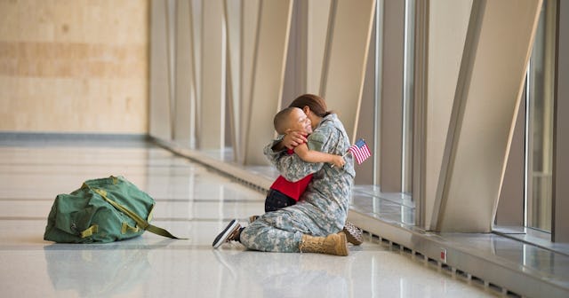 Female veteran hugging her son in airport — Veterans Day quotes.