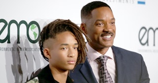 Will Smith and Jaden Smith on a red carpet in suits 