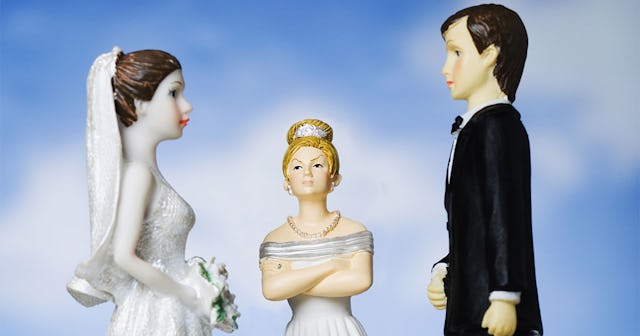 Three figurines of a bride, mother-in-law, and groom for the top of a wedding cake