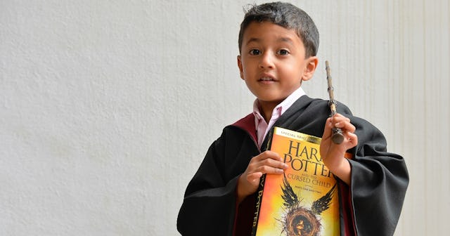 Little boy with Harry Potter book — Harry Potter reading level