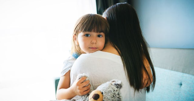 An adoptive mother hugging her daughter