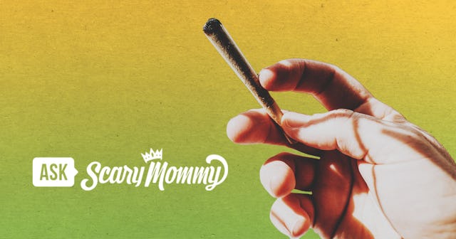 Mom holding a joint in hand and smoking weed