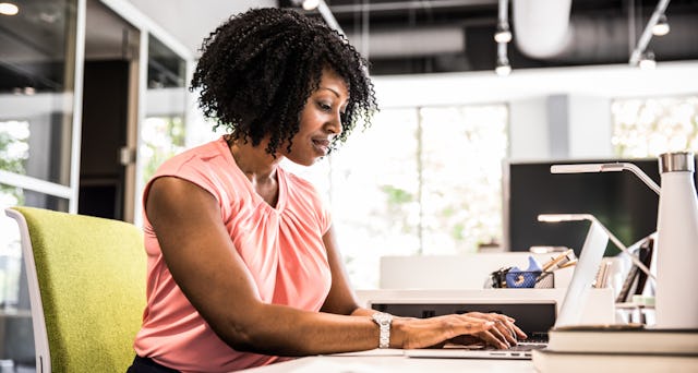 Business woman working on her laptop