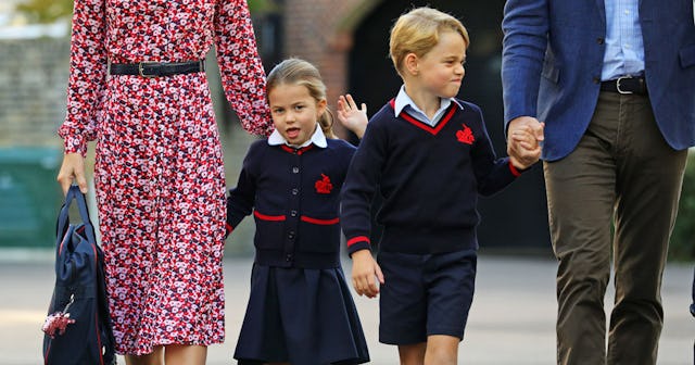 Princess Charlotte walks with her brother Prince George in the same school uniform while holding the...