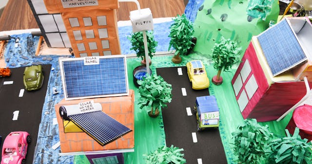 A model of a city showing streets, buildings, cars and trees made for a science fair
