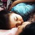 Mother and daughter sleeping together