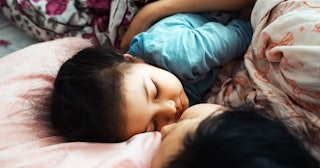 Mother and daughter sleeping together