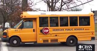 A yellow school bus from Herricks Public School 