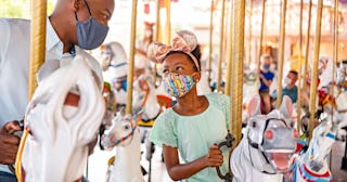 Father and daughter on carousel at Disneyland — Disney captions