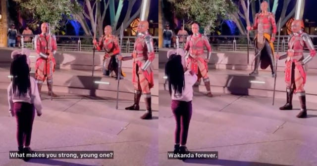A screenshot of a little girl's Wakanda Forever moment at Disney video