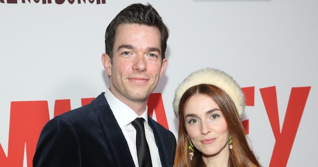 Anna Marie Tendler and John Mulaney on the red carpet premiere smiling and posing