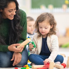 Daycare teachers spend a lot of time with children, like this engaging teacher, so it's important to...