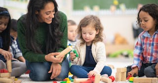 Daycare teachers spend a lot of time with children, like this engaging teacher, so it's important to...