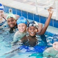 Summer camp ideas: a group of five children in a swimming pool together