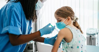 A little girl getting vaccinated for COVID-19