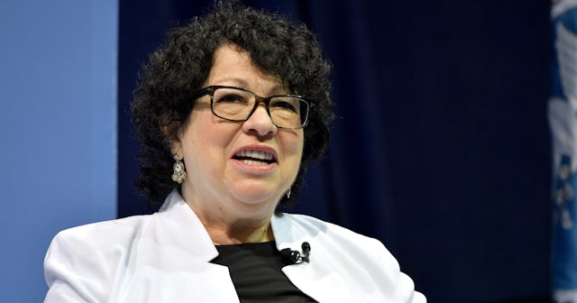 Supreme Court Associate Justice Sonia Sotomayor, in a black top and a white suit