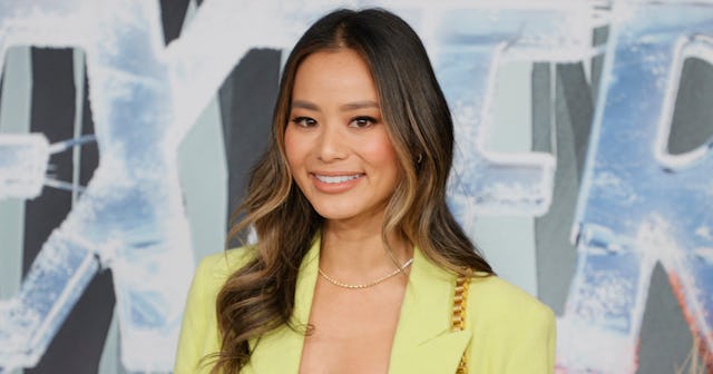 American actress Jamie Chung wearing a yellow suit and smiling
