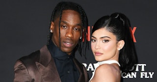 Kylie Jenner and Travis Scott on the red carpet standing and posing together
