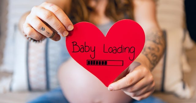 Valentine's Day baby announcements can be as simple as a paper heart with the words 'baby loading.'