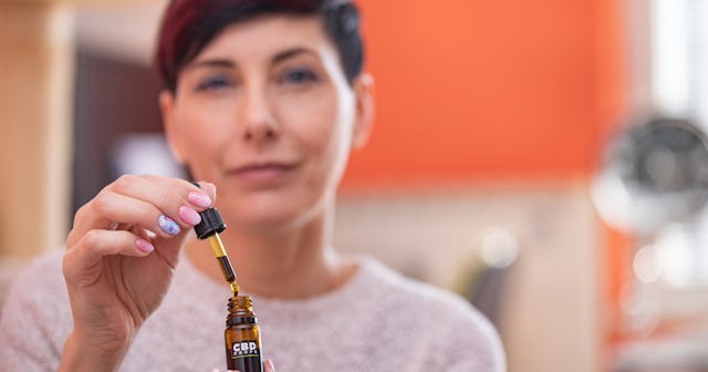 woman with CBD oil