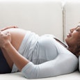 pregnant woman lying on a couch