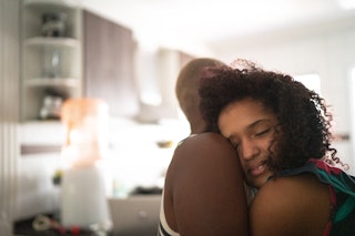 Mother and daughter embracing after mental health conversation