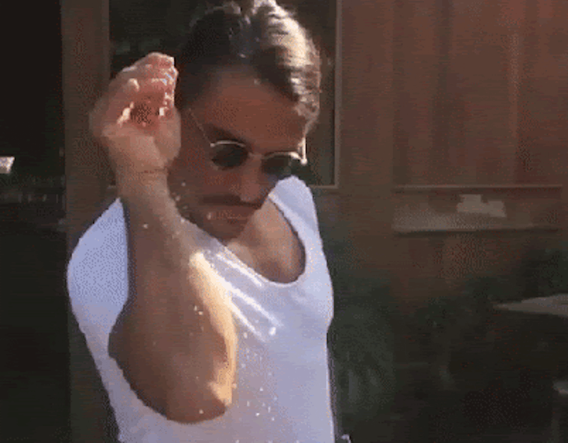 Salt Bae sprinkling salt from his right hand GIF