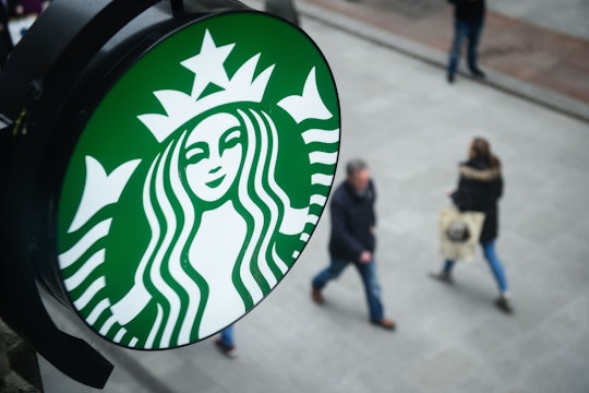 A Starbucks logo on the street 