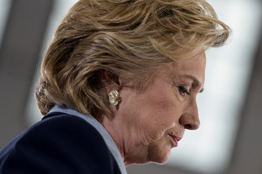 Hillary Clinton walking in a black blazer