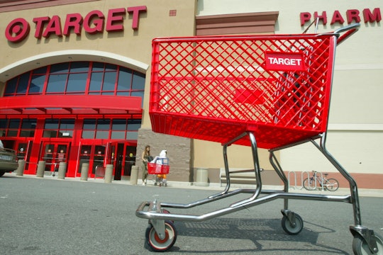 A red trolley in the parking lot of a Target