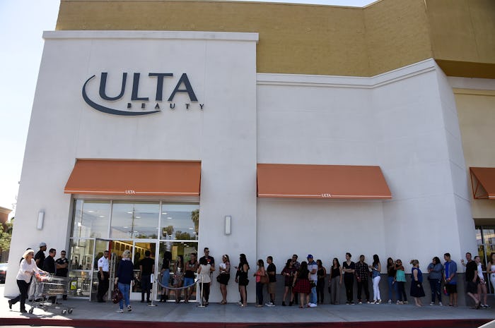People lining up outside of an Ulta store.