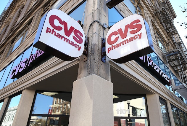 Two CVS pharmacy signs on the building.