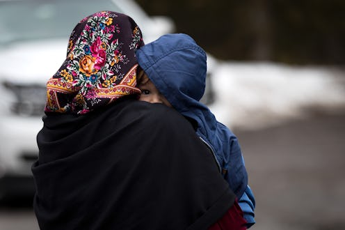 A parent with trauma holding a kid