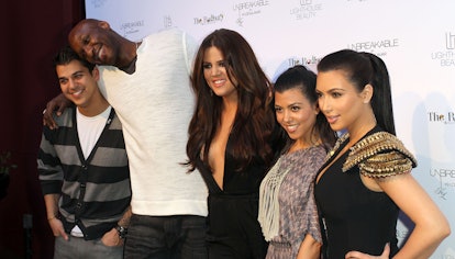Image of Kendrick Lamar, Khole, Kourtney and Kim Kardashian and a young man on the red carpet