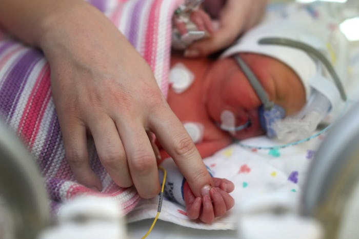 A mother touching a baby with HELLP Syndrome