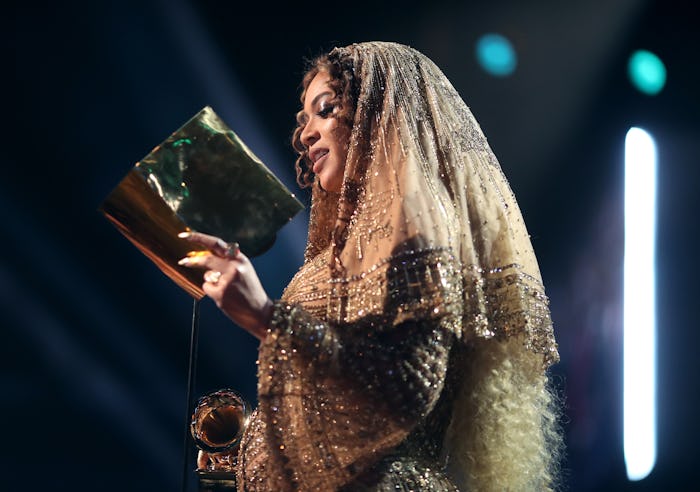 Beyoncé at the Grammys in a golden dress and veil