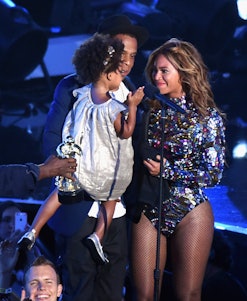 Beyoncé, Jay Z with their daughter on stage 