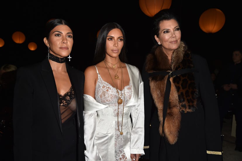 Kim, Kourtney, and mom Kris Jenner posing for a photo