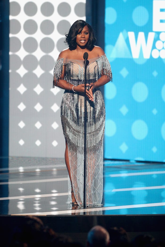 Remy Ma in a sheer neckline and banded waist dress during her Best Female Rapper Award speech at the...
