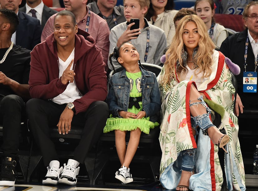 Beyoncé, Blue Ivy Carter, and Jay-Z at an NBA match