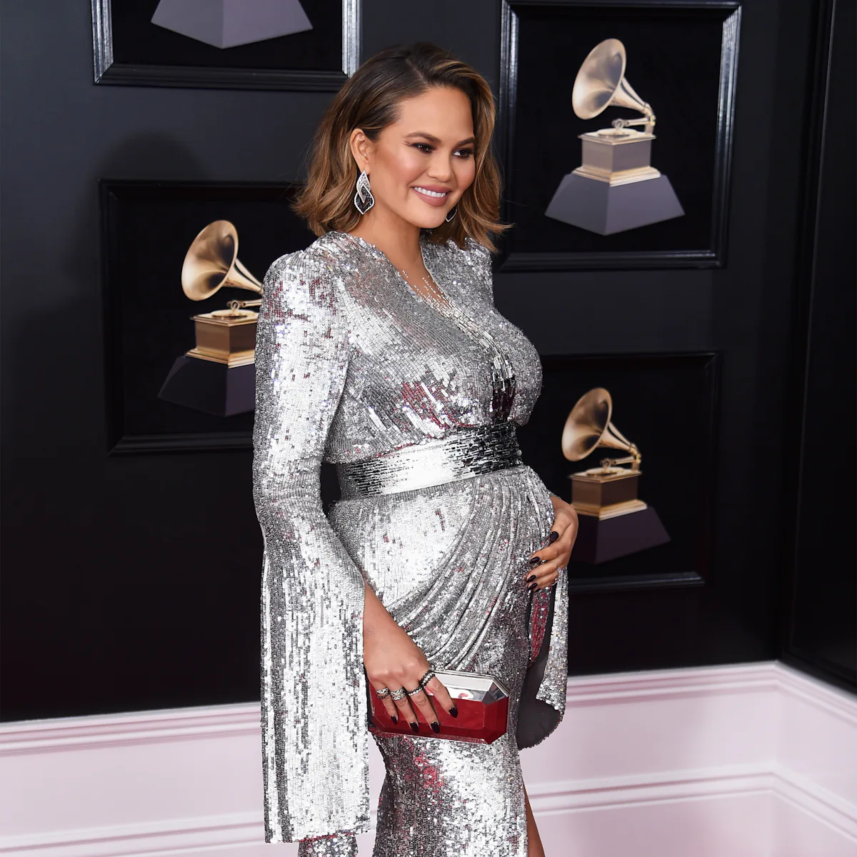 chrissy teigen silver dress Chrissy Teigen's 2018 Grammys Red Carpet Look Is Legendary & I Can't Look Away
