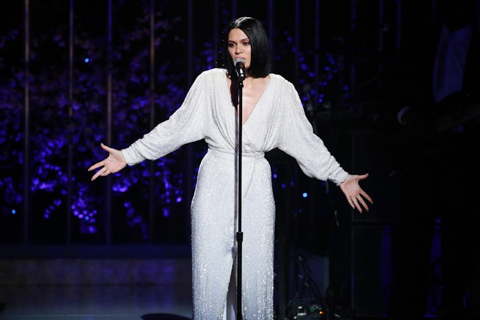 Jessie J in a white romper on stage during a performance in London
