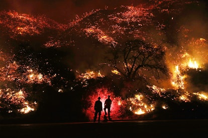 Firefighters standing in front of California wildfires
